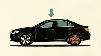 JP Morgan cuts General Motors price target; a car silhouette with a downward arrow above it.